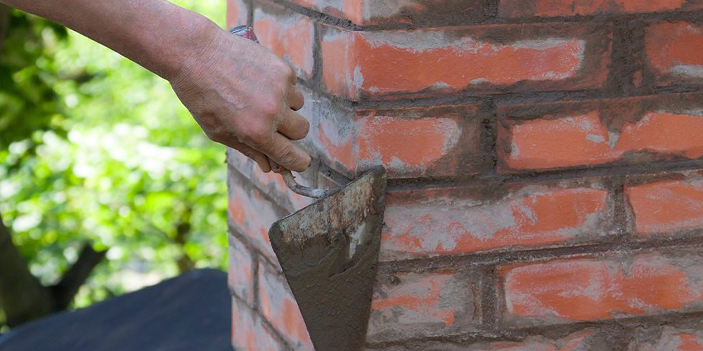 Photo Of Man Fixing A Chimney